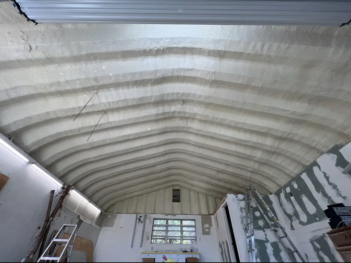 Spray polyurethane foam applied to the underside of a metal roof deck in North Adams