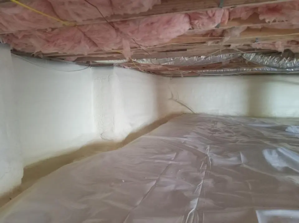 Crawl space encapsulation with closed-cell spray foam for Commercial Roof Restoration in North Adams